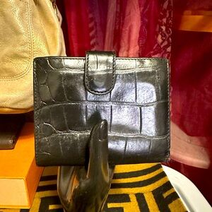 Furla bi-fold wallet in croc embossed black leather. Excellent condition.